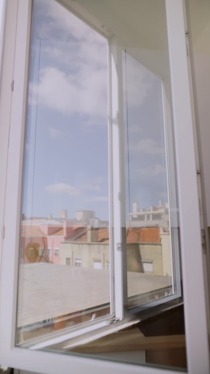 Open Window with City View