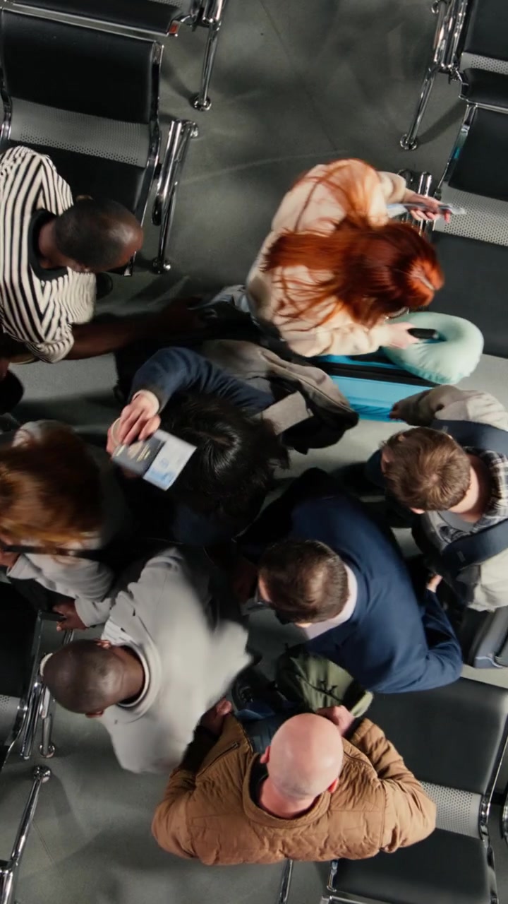 Diverse Travelers with Luggage Waiting in Airport Terminal, Top Down View