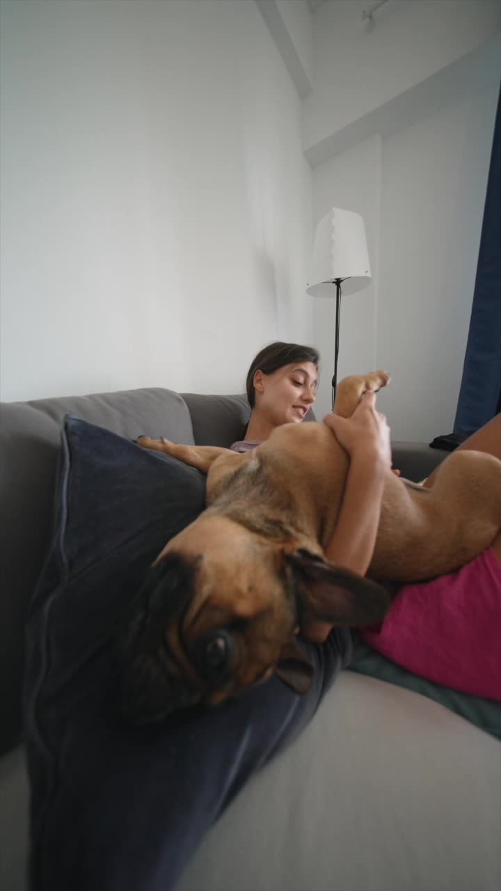 Woman and dog on couch