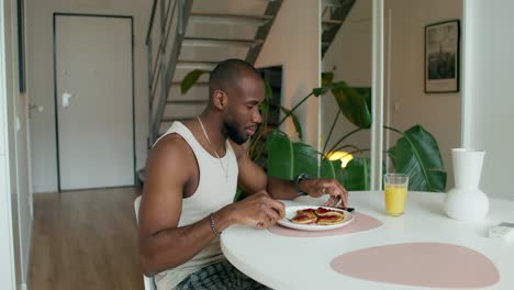 man having breakfast at home