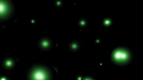 green glowing spheres on black background