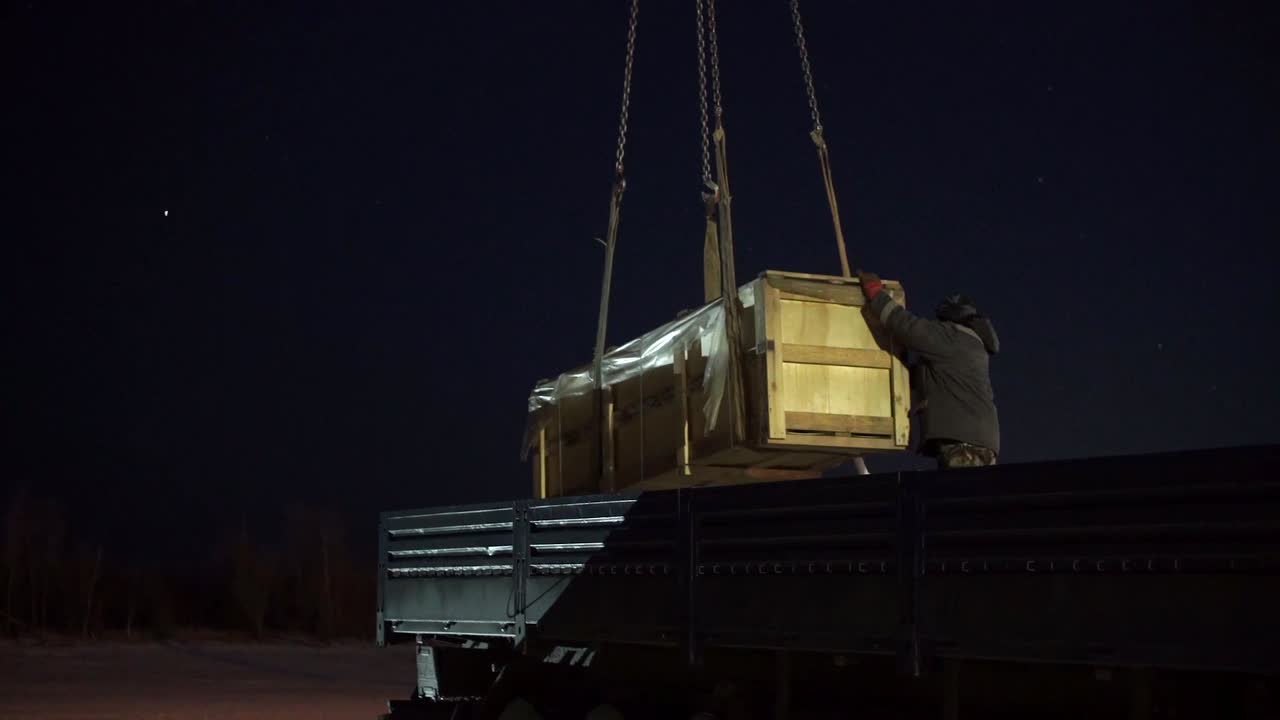 Nighttime Cargo Loading on a Truck