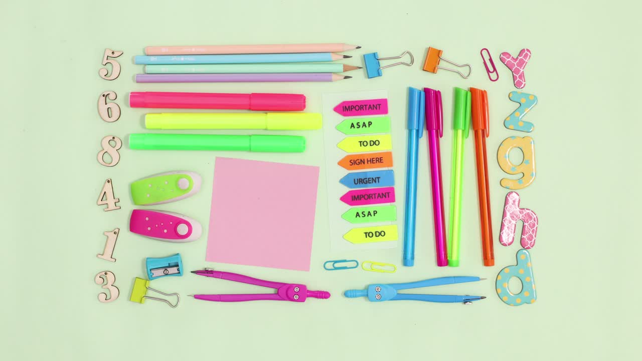 Creative back to school layout made of school stationery move on green theme. Stop motion