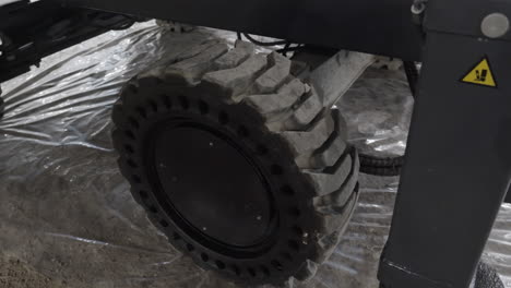 close-up view of a large industrial vehicle wheel.