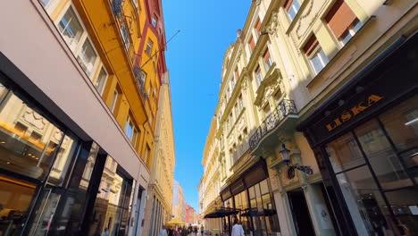 facades of the four-storied old buildings along the lovely street. low angle view. stroll by the old town of bratislava, slovakia
