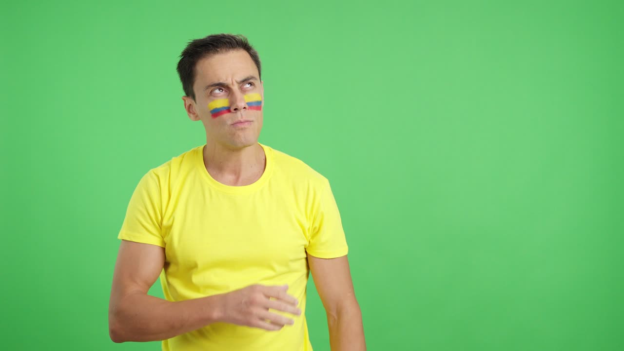 Man listening to the Colombia national anthem with solemnity