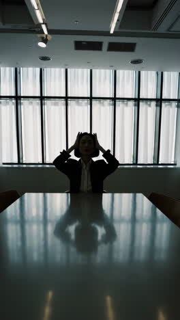 stressed business woman in conference room