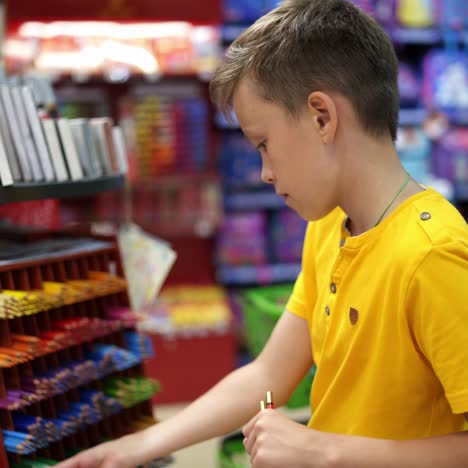cute boy in stationery store
