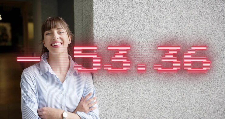 Technology professional leaning on concrete wall, numeric overlay floating and sparking smile