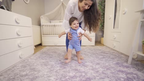 happy baby takes his first step.