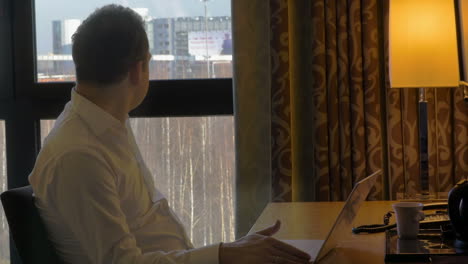 businessman with laptop at work desk