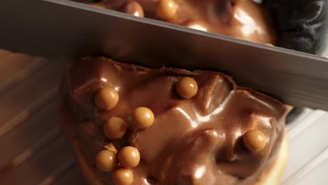 ferrero chocolate donut being cut in half