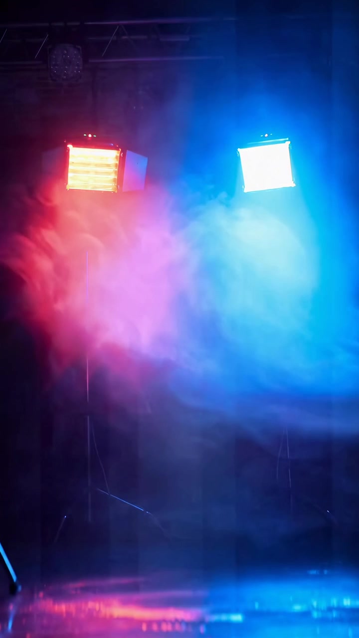 Stage Lighting With Red and Blue Beams and Atmospheric Smoke