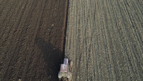 Dramatic-overhead-aerial-with-tilt-up-reveal-over-farming-lands