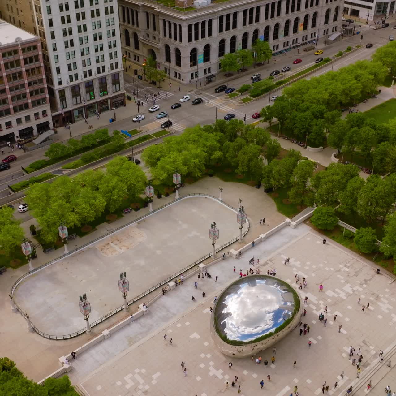 Famous Bean sculpture in Millennium Park in Chicago, Illinois. Well-known landmark at the backdrop of beautiful city architecture
