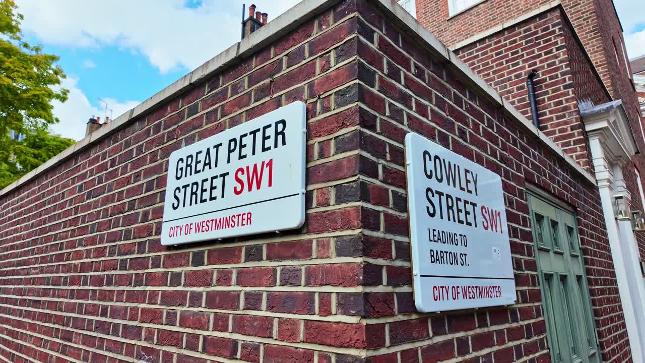 Close-up view from the street sign of Great Peter Street and Cowley Street, London, England.