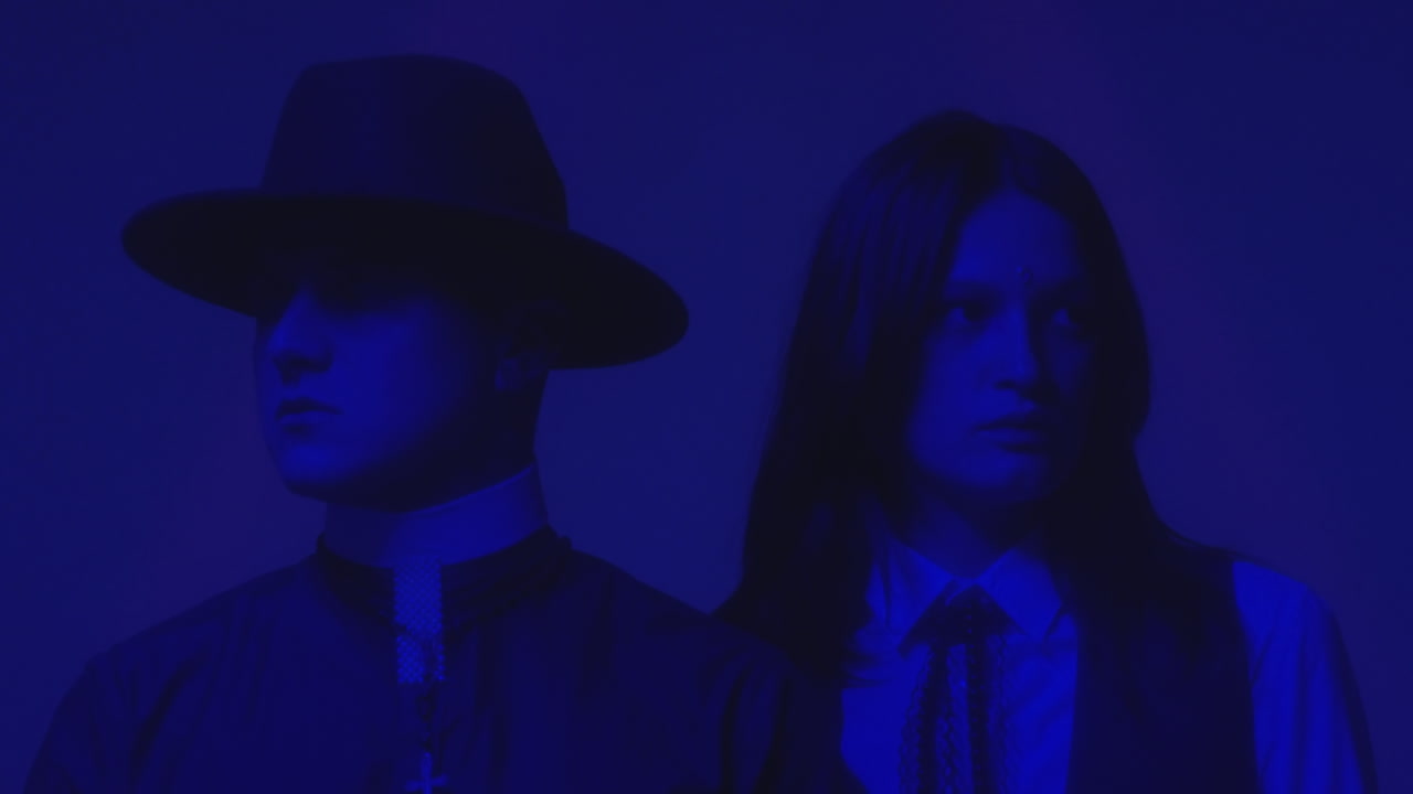 Schoolgirl and Priest in Neon Light