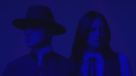 schoolgirl and priest in neon light