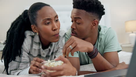 Popcorn,-bedroom-and-couple-on-laptop-for-movie