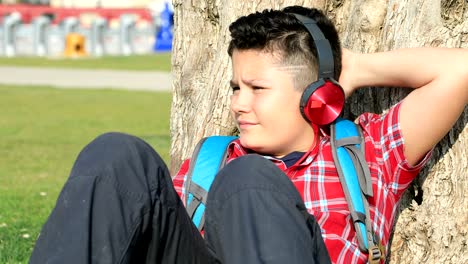 preteen boy relaxing under sun