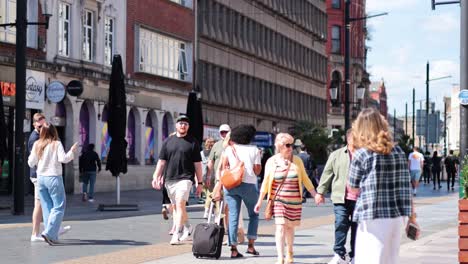 pedestrians walking in cardiff city center