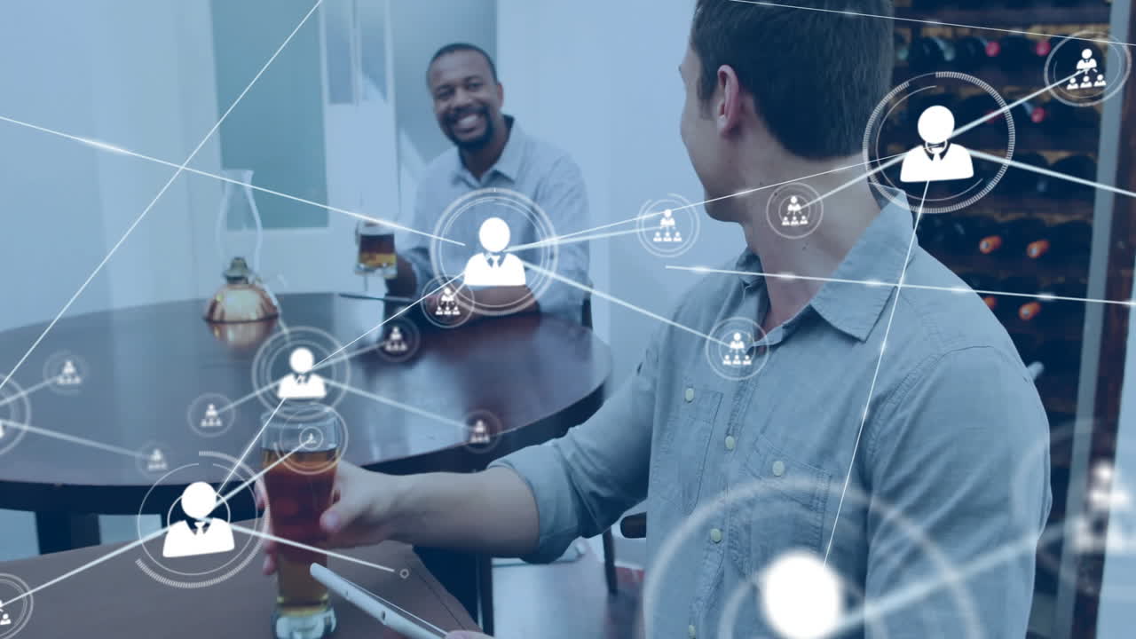 Animation of network of connections with people icons over caucasian man with tablet