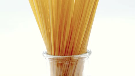 raw spaghetti arranged in container