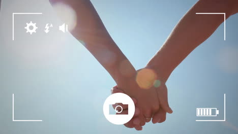 tomando fotos de una pareja con una cámara digital