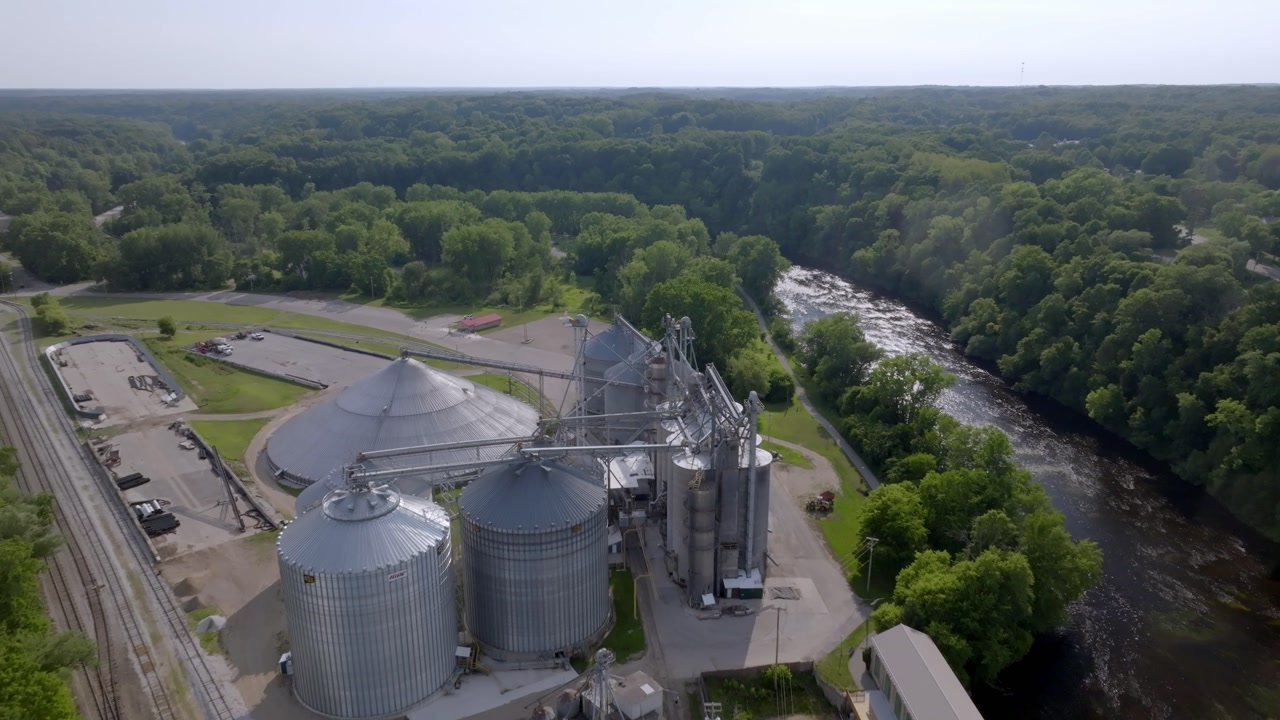 Grain elevator in Newaygo, Michigan with drone video moving in.