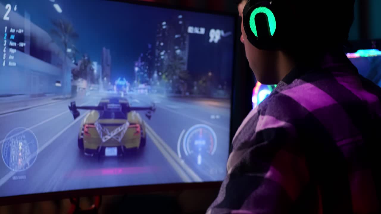 Close Up Of Asian Teen Boy Gamer Lose While Playing Video Game On Computer, Playing A Racing Video Game