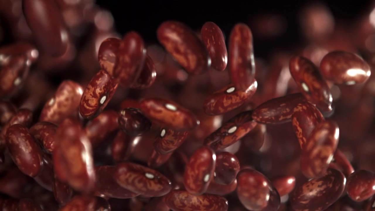 Red Kidney Beans Falling in Slow Motion on Black Background