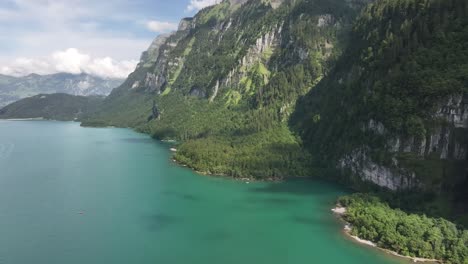 Aerial-view-of-the-scenic-Klöntalersee-lake-in-Klöntal,-with-Vorderglärnisch-in-Glarus-Süd,-Switzerland,-showcasing-the-concept-of-breathtaking-alpine-beauty-and-tranquility