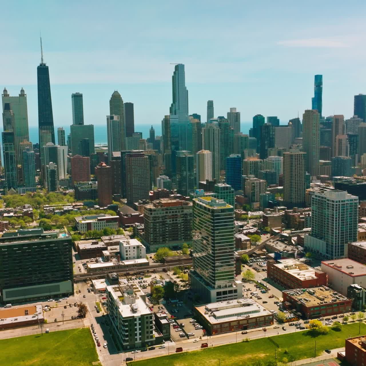 Green quarters with blocks of flats and numerous parking lots. Usual architecture at the backdrop of fantastic skyscrapers