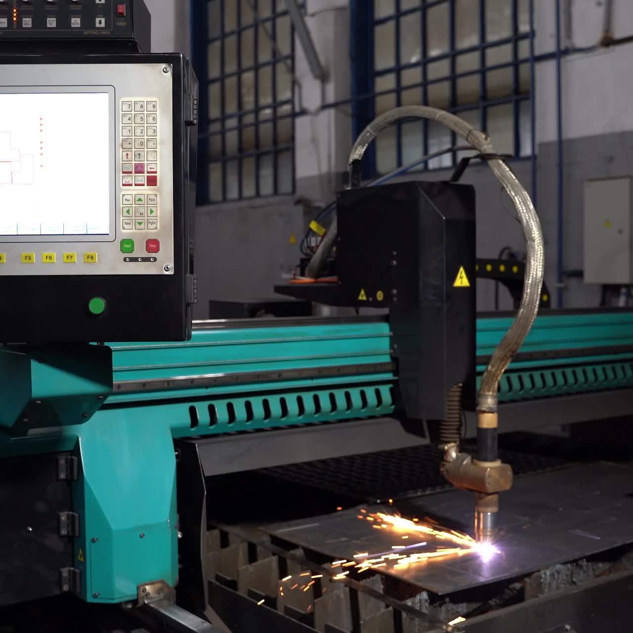 The laser cuts the metal. Industrial equipment for metal cutting. Machine with a laser