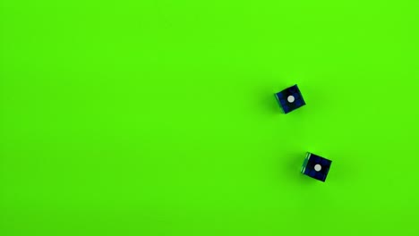 blue dice rolling craps (double ones) on green screen