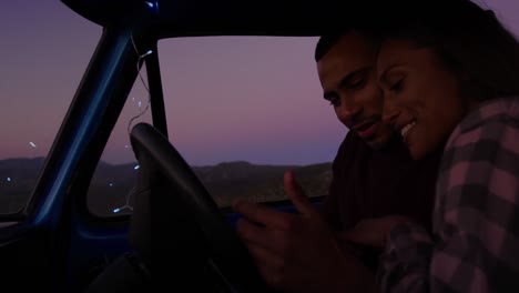 Young-couple-on-a-road-trip-in-their-pick-up-truck