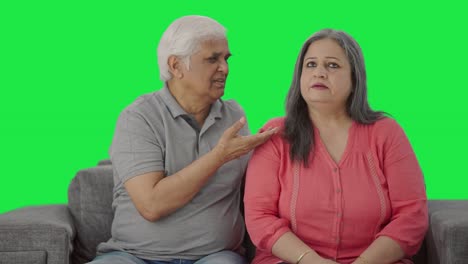 Guilty-Indian-old-husband-saying-sorry-to-his-wife-Green-screen