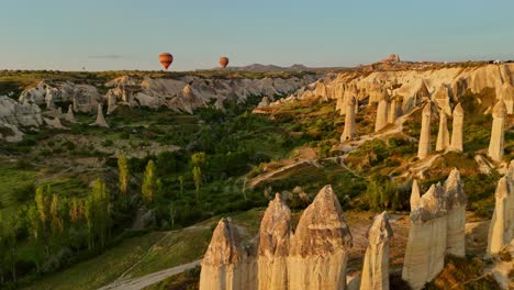 hot air balloons over cappadocia's unique rock formations at sunrise