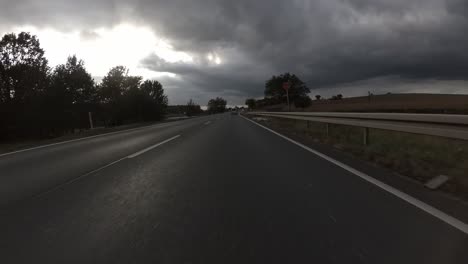 drive on german highway from the car's point of view with rainy clouds in the background, 4k