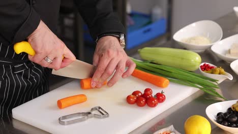 chef preparing vegetables for a dish