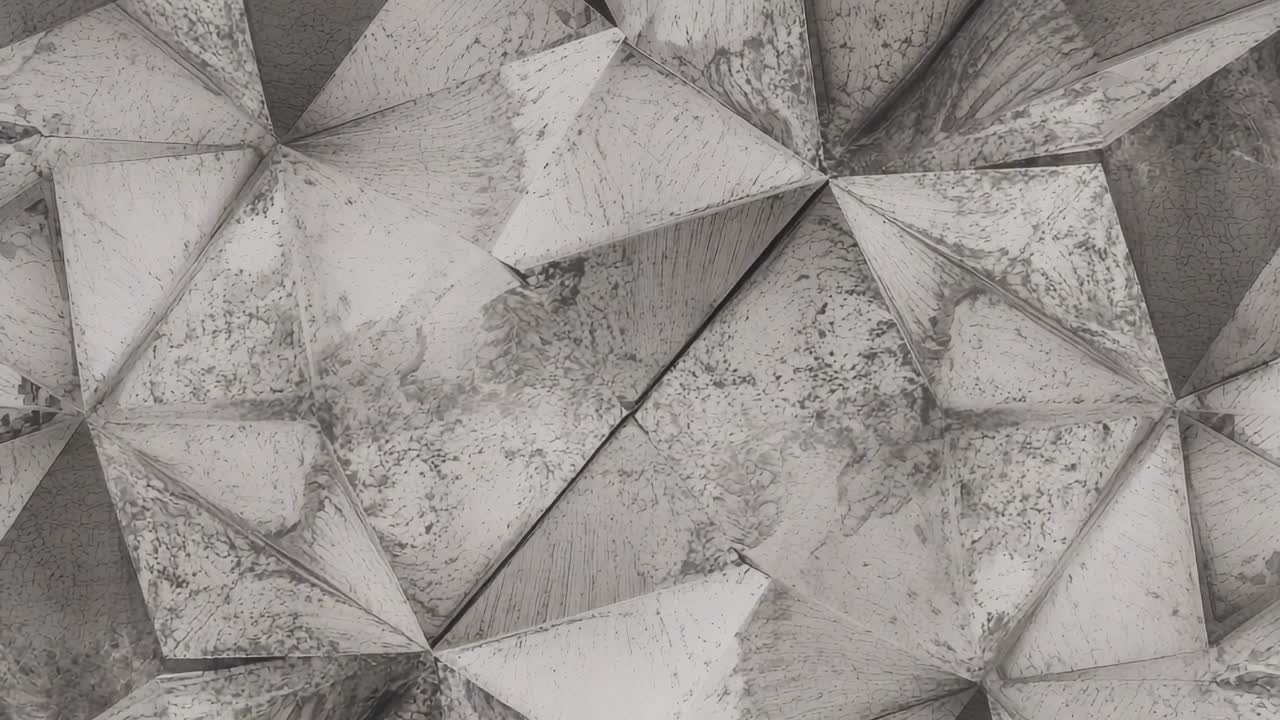 Panning camera revealing tessellated triangular pyramidal panels at interior wall, showing wear