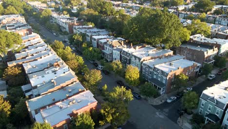 historic rowhouses and tree-lined streets in the fan district - richmond, virginia | aerial panning view | summer 2021