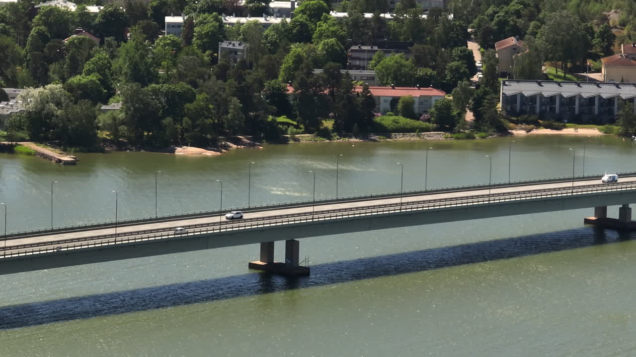 Telephoto drone shot of traffic on the Lapinlahti bridge, summer day in Helsinki