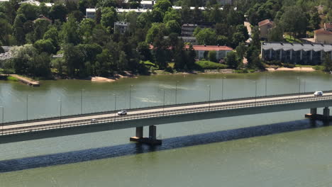 telephoto drone shot of traffic on the lapinlahti bridge, summer day in helsinki