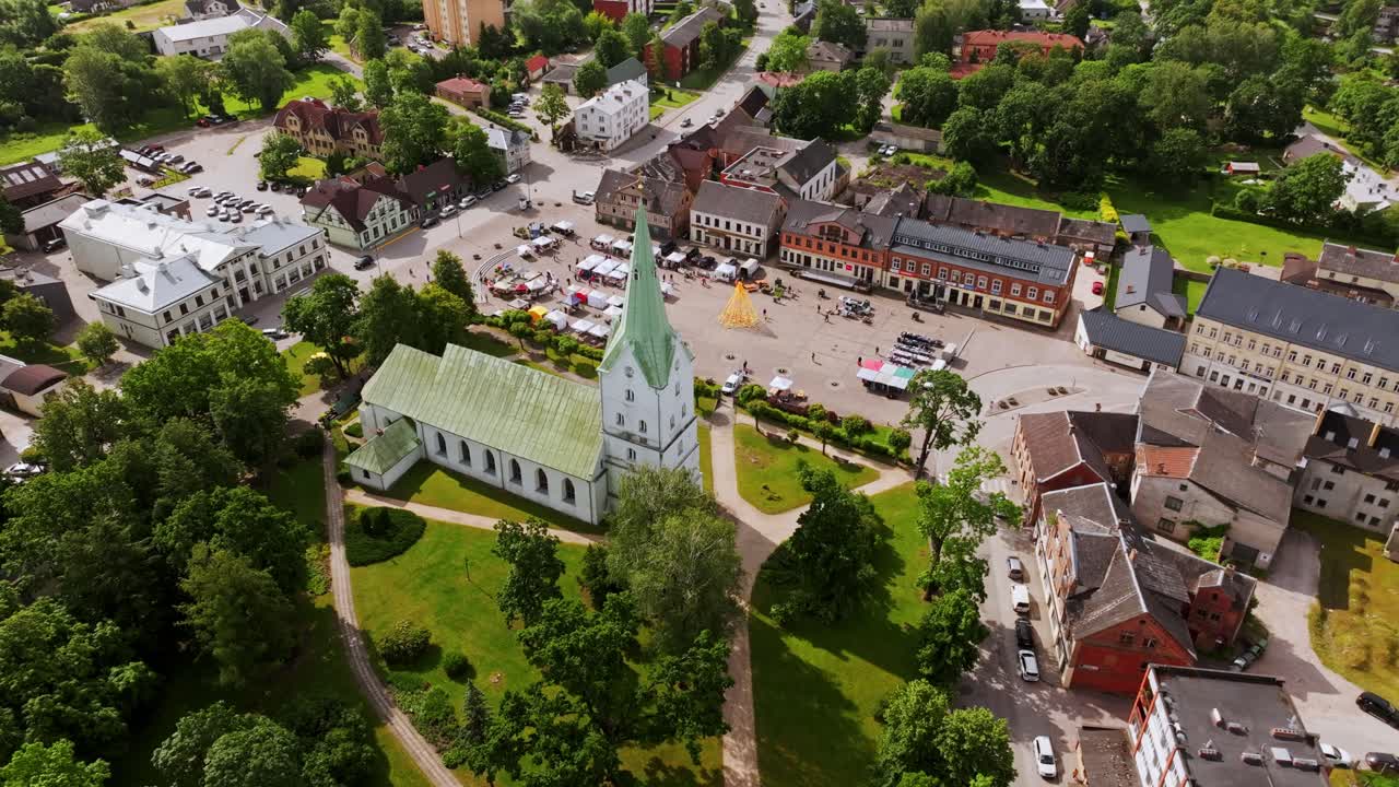 Aerial view of Dobele Latvia with Līgo festival market and white church, Europe