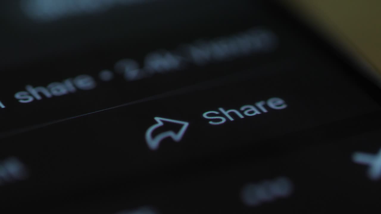 Finger on Share Button on Mobile Phone