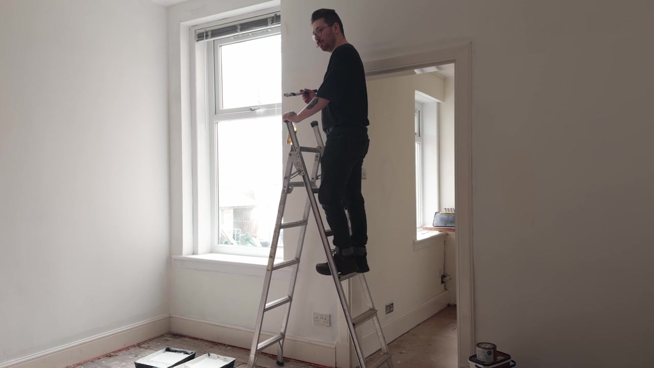 Decorating the interior of an apartment during renovation work. Captured inside a residential property as painting and refurbishment progresses
