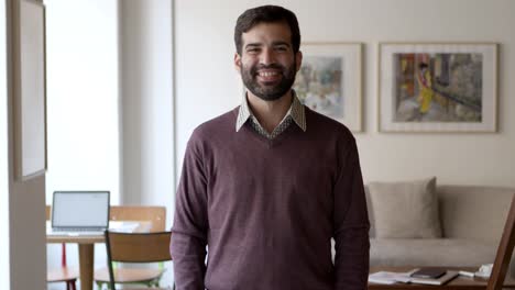 happy joyful bearded guy posing indoors