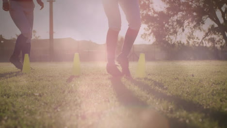 soccer team weaving between cones on field at sunset, showing animated speed metrics overlays