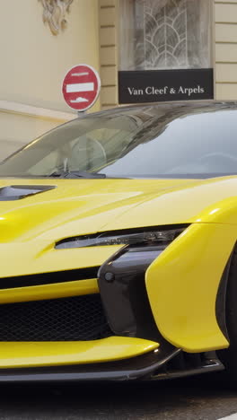 close-up of a yellow sports car in an urban setting